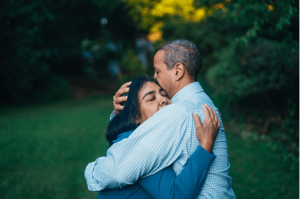 two people embracing in a supportive hug