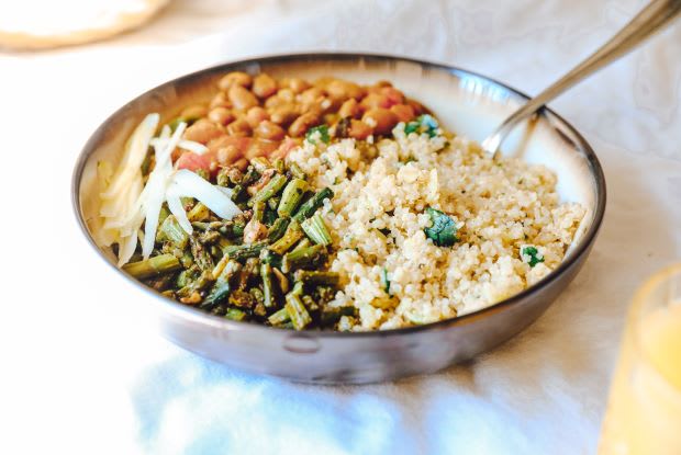 a plate of quinoa, beans, and spinach