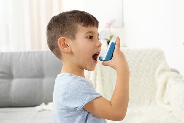 a child using an inhaler