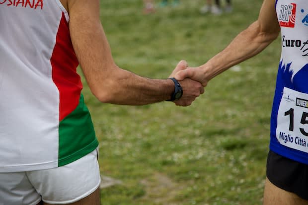 two athletes shaking hands