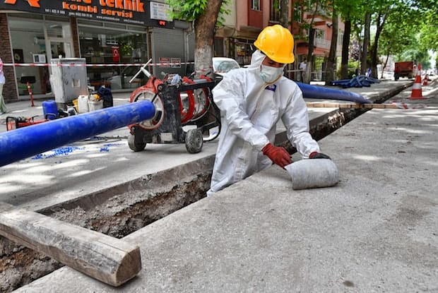 a construction worker wearing a face mask