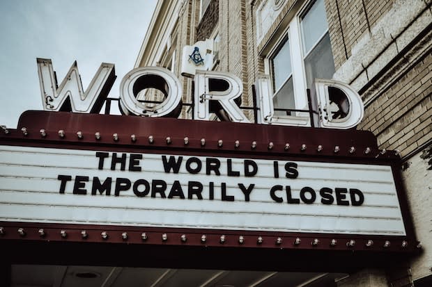 a marquee that says ‘the world is temporarily closed’