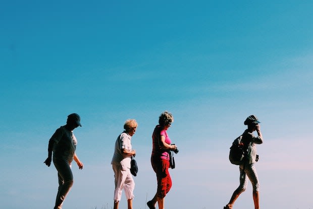 a group of older women on a scenic hike