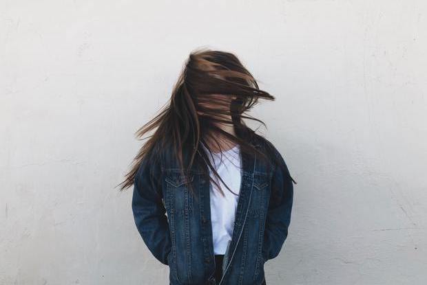 a woman shaking her hair