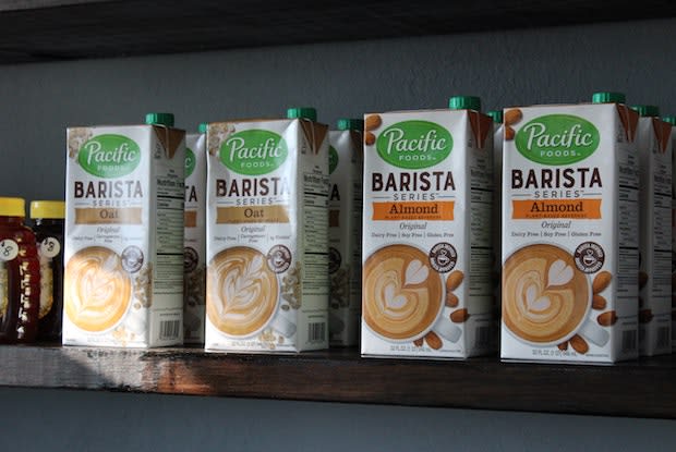 almond and oat milk on a shelf