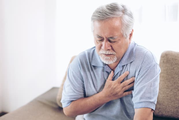 a man clutching his chest