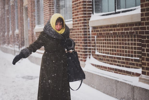 a woman walking in the snow