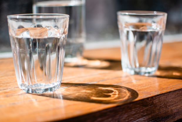 two water glasses on a table