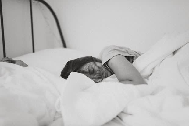 a woman lying in bed