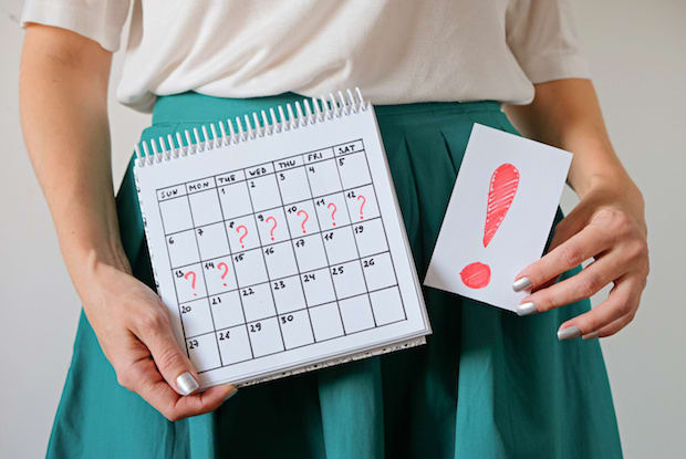 a woman holding a calendar