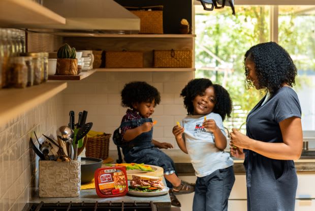 a woman cooking with children