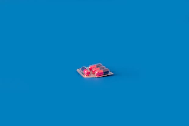 a pack of pills on a blue background