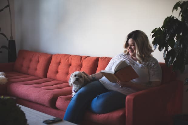 an obese woman sitting on a couch