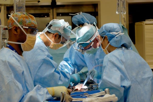 doctors performing a surgical procedure