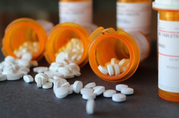 Pills falling out of prescription medication bottles