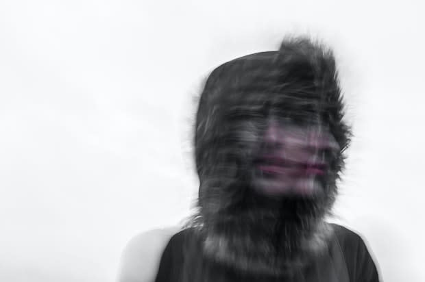 a person with a blurred face