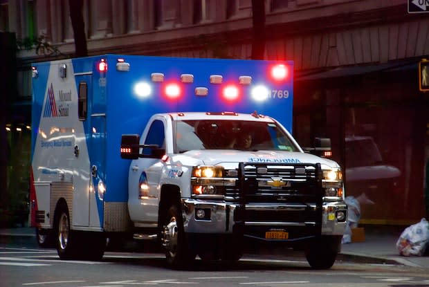 an ambulance with its emergency lights on