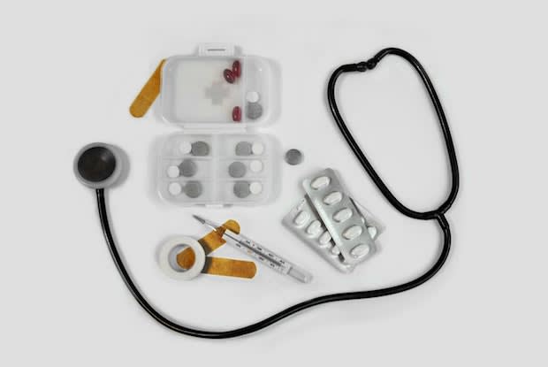 a stethoscope alongside pill containers