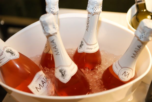 several bottles of wine in an ice bucket