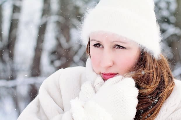 a woman bundled up in the snow