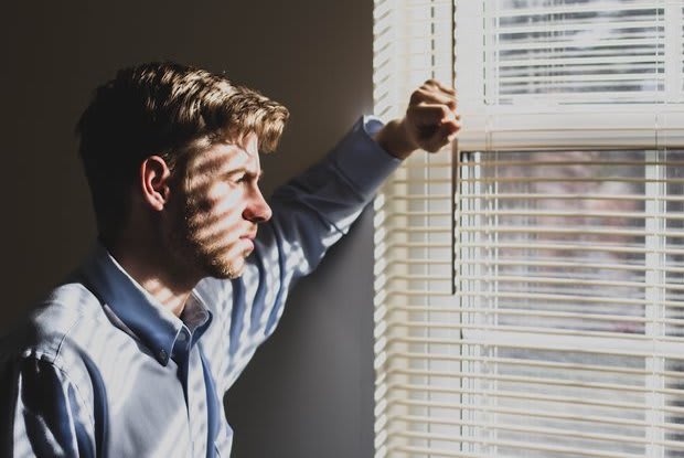 a man looking outside the window