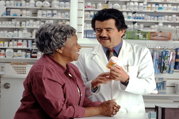 a pharmacist helping a lady