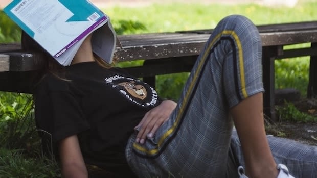 a student falling asleep while studying