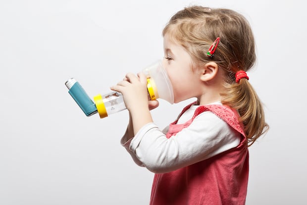 a child using an inhaler