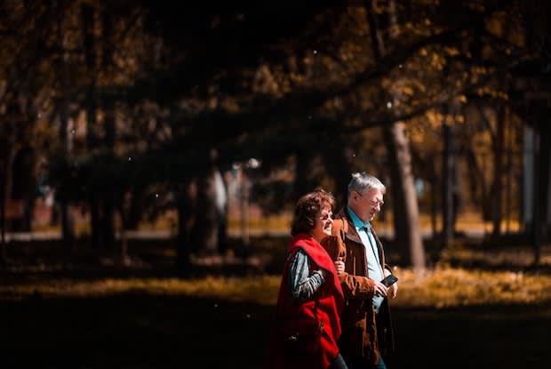 an older couple walking together