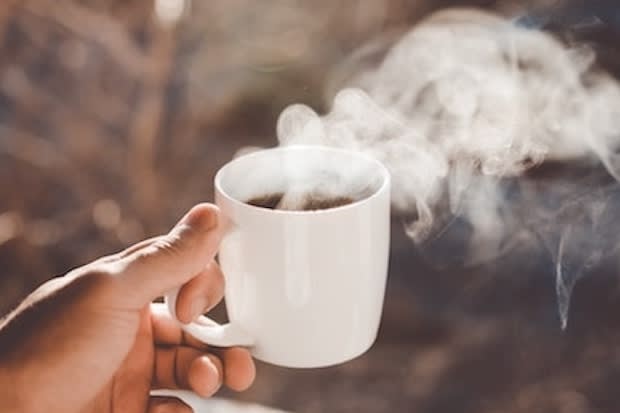 a steaming cup of coffee