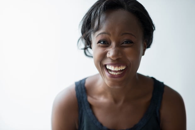 Woman looking into camera smiling