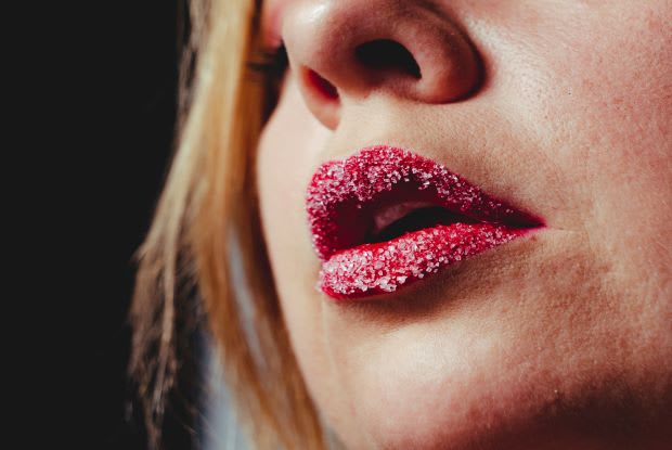 a woman with sugar on her lips