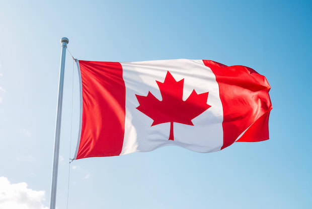 a Canadian flag waving in the wind