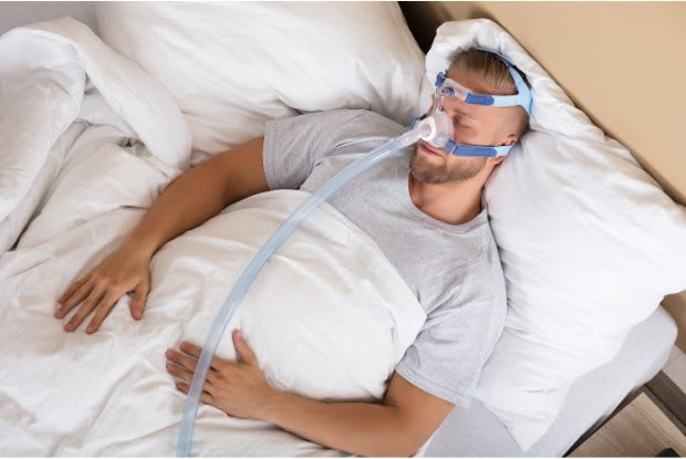 a man using a CPAP machine