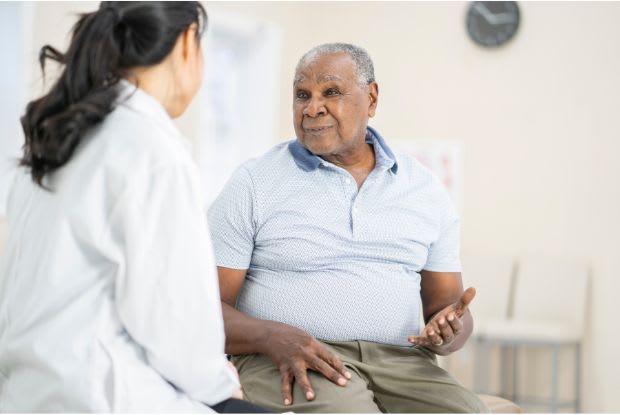 a man with obesity visiting a doctor