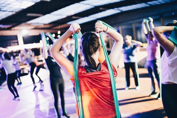 a woman participating in a group exercise class