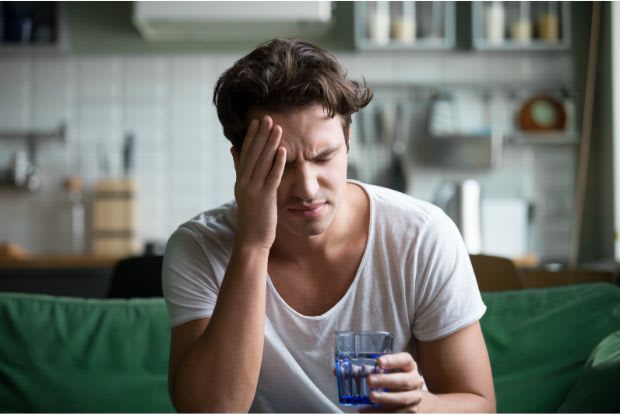 a man suffering from a headache