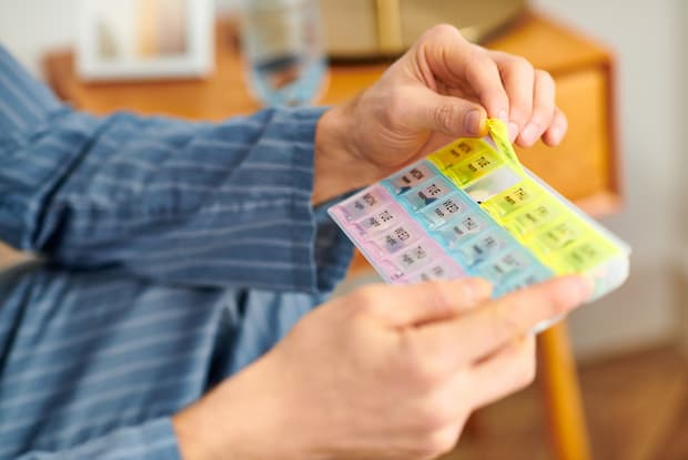 medication in a colourful pill organizer
