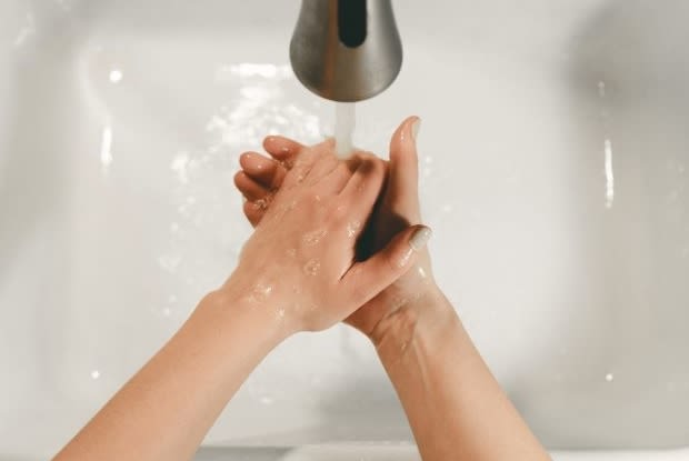 a person washing their hands