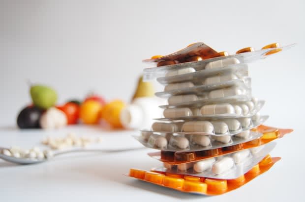 Several blister packs of medications piled up