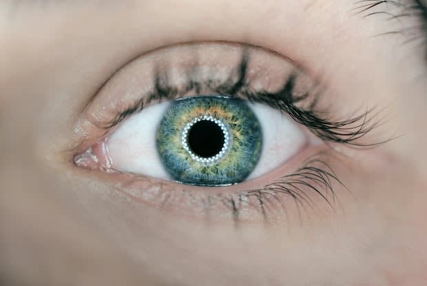 a close up of a green eye