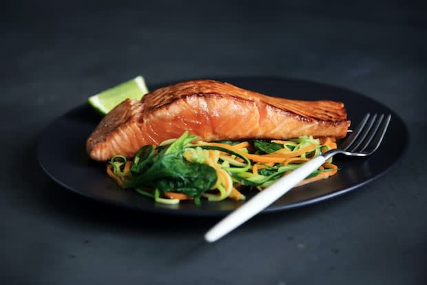 pan-seared salon on a plate of assorted vegetables