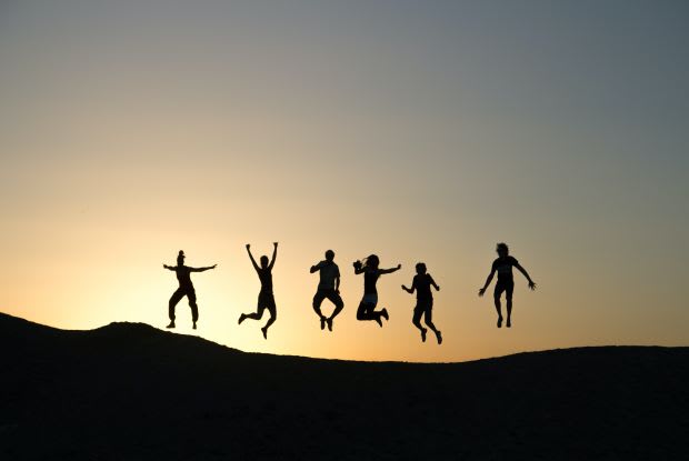 a group of people jumping