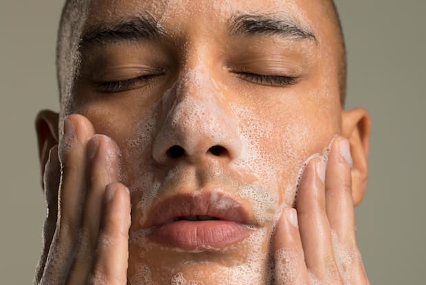 a man washing his face