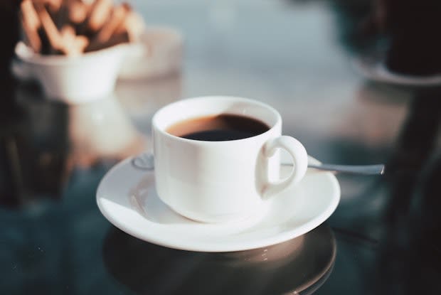 a cup of coffee in a white mug