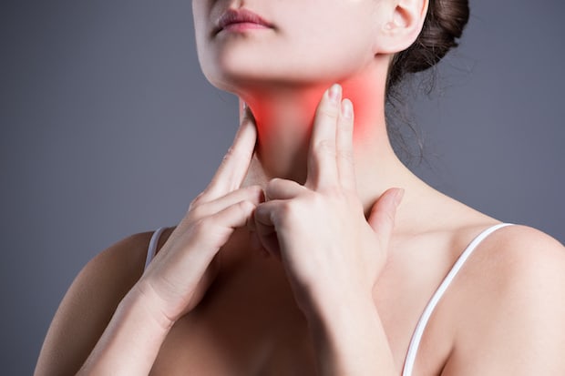 a woman with her swollen thyroid glands highlighted