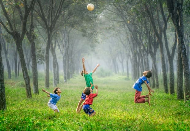 four children jumping in the air