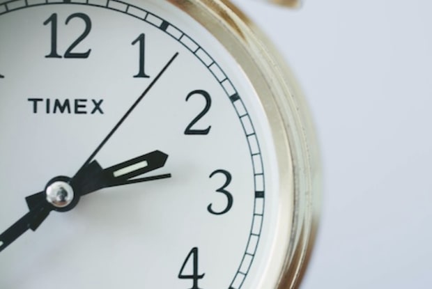 A close up of a clock face