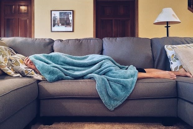 a person lying on the sofa