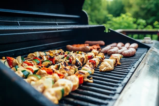 a display of cholesterol-increasing foods on a grill